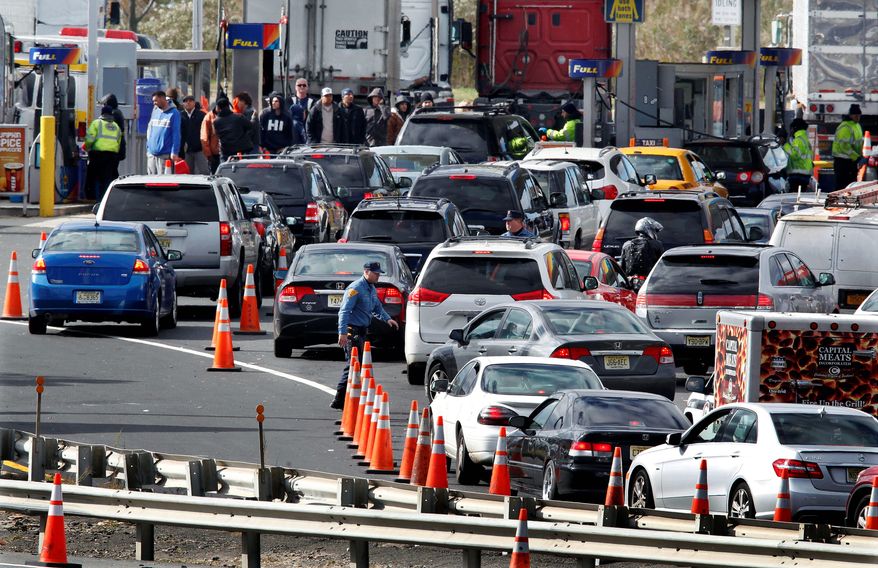 New Jersey state troopers kept order as motorists and pedestrians waited in long lines to purchase gasoline in the paucity following Superstorm Sandy. The storm's fallout highlighted the need for increased domestic oil reserves. (associated press)