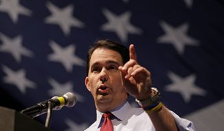 Wisconsin Gov. Scott Walker fended off a 2012 drive by liberals, angered by his disavowal of business as usual, to recall him from office. (Associated Press)