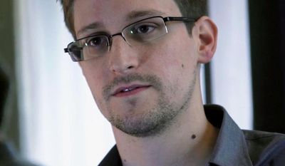 ** FILE ** A Sunday, June 9, 2013, file photo provided by The Guardian newspaper in London shows Edward Snowden, who worked as a contract employee at the U.S. National Security Agency. (AP Photo/The Guardian, File)