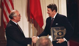 President Reagan and Soviet leader Mikhail Gorbachev signed the Intermediate Range Nuclear Forces Treaty in 1987 to ban missiles with ranges of 310 miles to 3,400 miles. Key members of Congress have told President Obama that Russia is material breach of the treaty. (Associated Press/File)