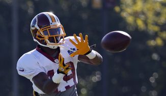 Washington Redskins receiver Rashad Ross catches a pass during practice at the team&#x27;s NFL football training facility, Monday, July 28, 2014 in Richmond, Va. (AP Photo/Alex Brandon)