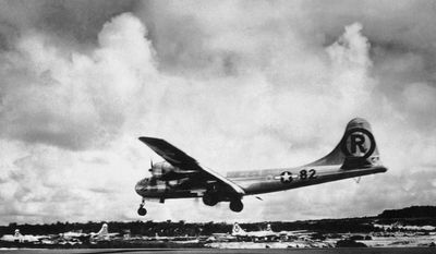In this Aug. 6, 1945 file photo, the Enola Gay Boeing B-29 Superfortress lands at Tinian, Northern Mariana Islands after the U.S. atomic bombing mission against the Japanese city of Hiroshima. (AP Photo/Max Desfor)