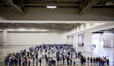 Job seekers wait in very long lines to enter Mayor Gray&amp;#226;&amp;#8364;&amp;#8482;s 2014 Citywide Hiring Fair at the Walter E. Washington Convention Center, Washington, D.C., Wednesday, July 30, 2014. (Andrew Harnik/The Washington Times)