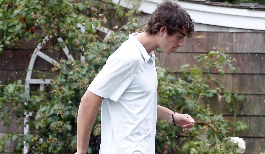 Conor Kennedy walks in the Kennedy Compound hours before the wedding of his father, Robert F. Kennedy Jr., and actress Cheryl Hines in Hyannis Port, Mass. on Saturday, Aug. 2, 2014. (AP Photo/Stew Milne) ** FILE **