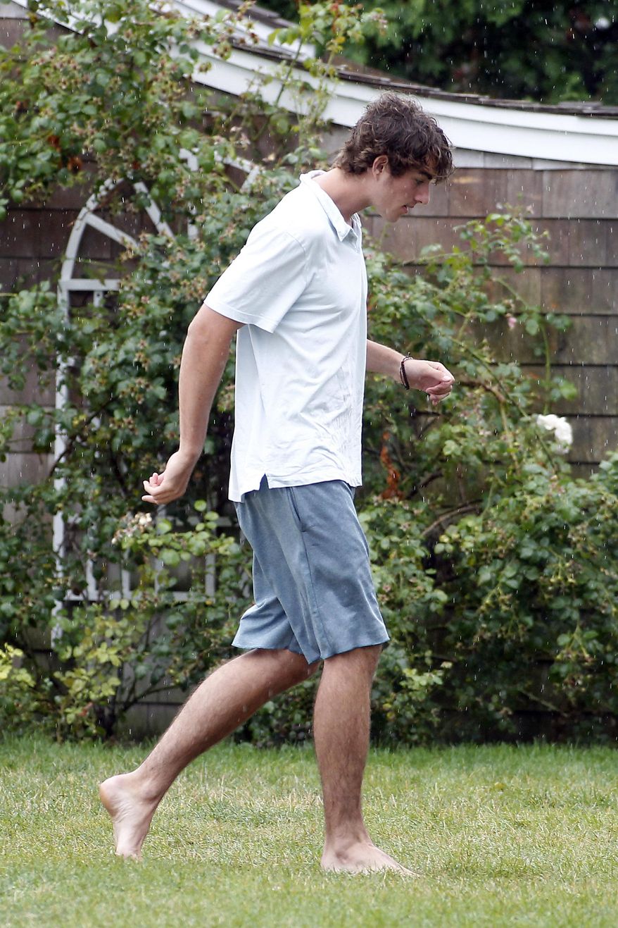 Conor Kennedy walks in the Kennedy Compound hours before the wedding of his father, Robert F. Kennedy Jr., and actress Cheryl Hines in Hyannis Port, Mass. on Saturday, Aug. 2, 2014. (AP Photo/Stew Milne) ** FILE **