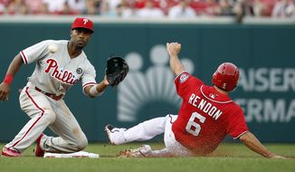 Philadelphia Phillies shortstop Jimmy Rollins waits for the throw as Washington Nationals&#39; Anthony Rendon safely steals second base during the first inning of a baseball game at Nationals Park Saturday, Aug. 2, 2014, in Washington. (AP Photo/Alex Brandon)