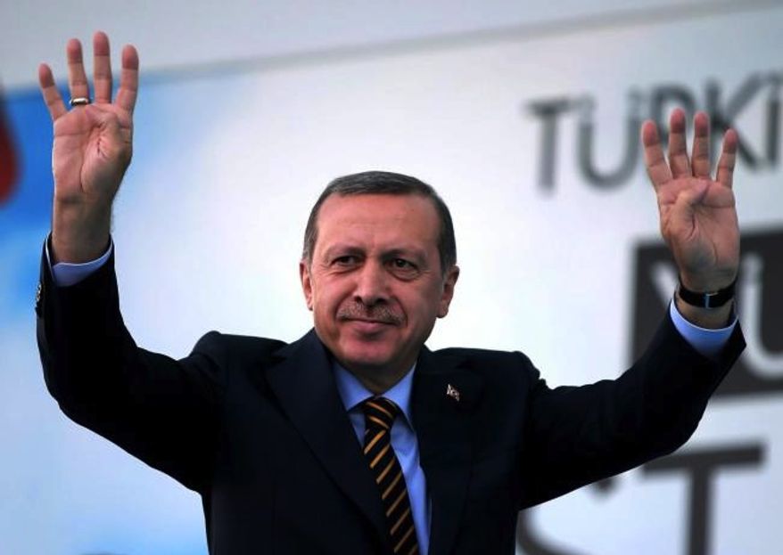 Turkish Prime Minister and presidential candidate of the ruling party in the August election, Recep Tayyip Erdogan waves to his supporters in Istanbul, Turkey, Friday July 25, 2014. (AP Photo/Emrah Gurel) 