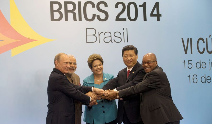 Leaders of the BRICS nations pose for a group photo during the summit in Fortaleza, Brazil, in July. From left: Russian President Vladimir Putin, Indian Prime Minister Narendra Modi, Brazilian President Dilma Rousseff, Chinese President Xi Jinping and South African President Jacob Zuma. The leaders of the BRICS nations are expected to officially create a bailout and development fund worth $100 billion. (Associated Press)
