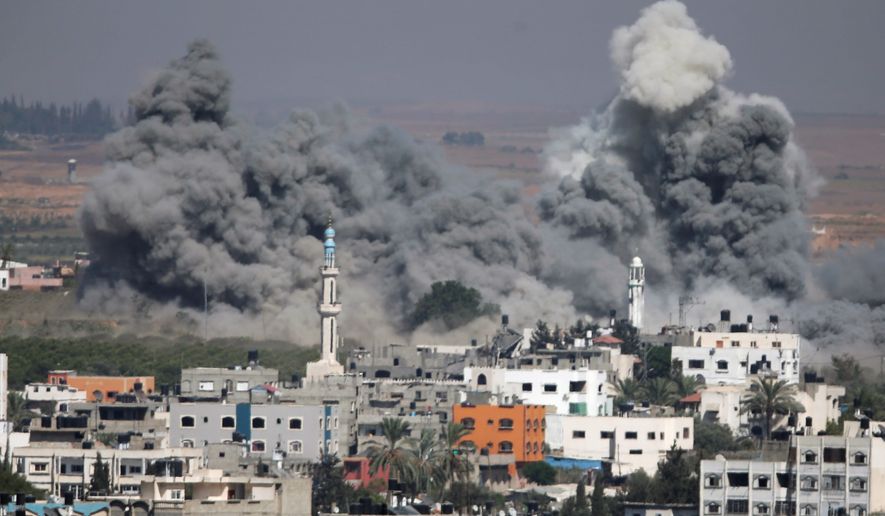 Smoke rises after an Israeli strike in Gaza City, northern Gaza Strip in July 31, 2014. With the U.S. and other countries trying to mediate a durable cease-fire between Israel and Hamas, another enthusiasm gap between the parties is emerging this midterm year, this one targeting the shifting feelings about the deep U.S. alliance with Israel. (Associated Press)