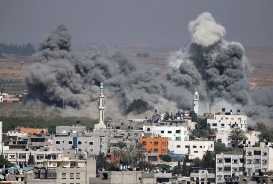 Smoke rises after an Israeli strike in Gaza City, northern Gaza Strip in July 31, 2014. With the U.S. and other countries trying to mediate a durable cease-fire between Israel and Hamas, another enthusiasm gap between the parties is emerging this midterm year, this one targeting the shifting feelings about the deep U.S. alliance with Israel. (Associated Press)