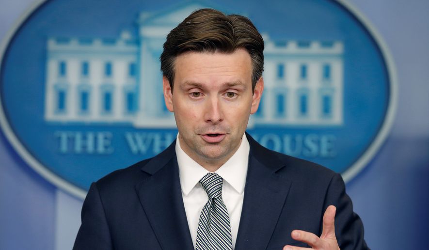 White House press secretary Josh Earnest says that Congress should take the necessary steps to close the loopholes that American companies use to move their headquarters overseas as a way to avoid paying corporate taxes. (associated press)