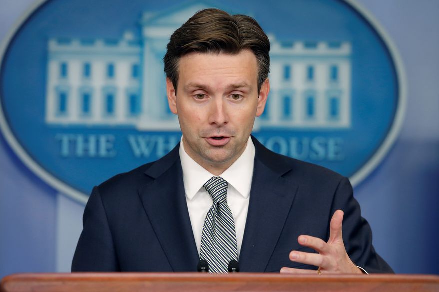 White House press secretary Josh Earnest says that Congress should take the necessary steps to close the loopholes that American companies use to move their headquarters overseas as a way to avoid paying corporate taxes. (associated press)