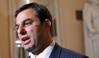 In this July 24, 2013, file photo, Rep. Justin Amash speaks on Capitol Hill in Washington. (AP Photo/J. Scott Applewhite, File) 