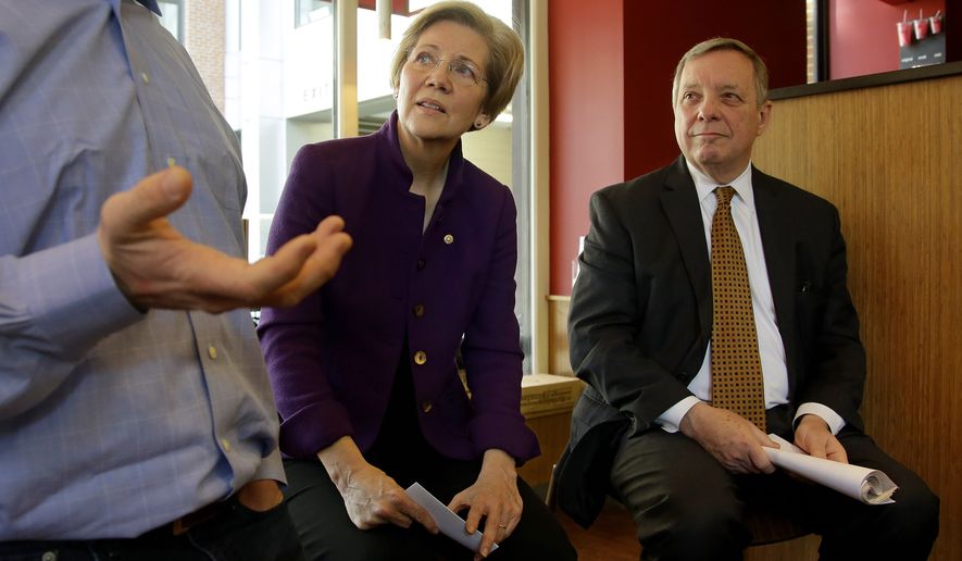 **FILE** Sen. Elizabeth Warren, D-Mass., center, and Senate Majority Whip Richard Durbin of Ill., right, listen as Boloco founder John Pepper speaks during a minimum wage roundtable discussion held at Boloco. a fast food chain of burrito restaurants in Boston, Monday, Feb. 10, 2014. Boloco pays a minimum wage of $9.00 per hour while the current federal minimum is $7.25 per hour. (AP Photo/Stephan Savoia)