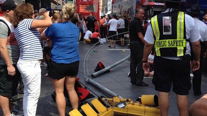 Emergency responders are on the scene of a double-decker bus crash in Times Square. (NBC4/@jprice141788/Instagram)