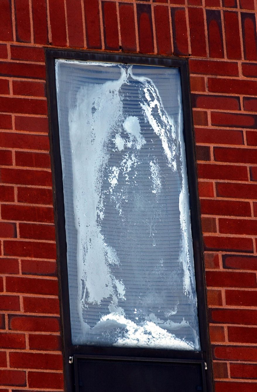 A third floor window, where visitors believe they see a white apparition of the Virgin Mary, is seen at Milton Hospital in Milton, Mass.,Tuesday, June 17, 2003. (AP Photo/Chitose Suzuki)