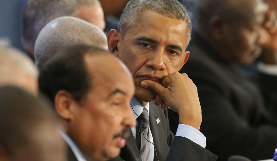 President Barack Obama listens as Mohamed Ould Abdel Aziz, president of the Islamic Republic of Mauritania speaks during the first session of the U.S. Africa Leaders Summit in Washington, Wednesday, Aug. 6, 2014. (AP Photo/Charles Dharapak)