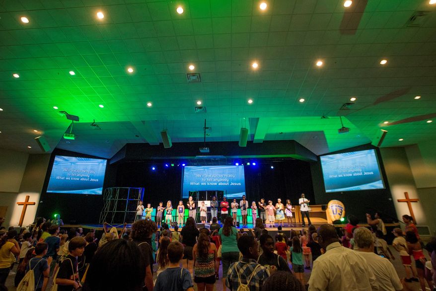 Children and volunteers take part in a worship rally to close out the last day of vacation Bible school at the Church at Severn Run in Maryland's Anne Arundel County. (Photographs by Eva Russo/Special to The Washington Times)