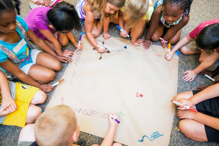 KEEPING THE FAITH: Students at the 6-year-old level use the last day of Bible school to illustrate what they've learned this summer at the Church at Severn Run. (Eva Russo/Special to The Washington Times)