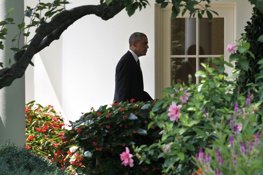 President Barack Obama returns to the Oval Office of the White House in Washington, Thursday, Ayg. 7, 2014, after signing H.R. 3230, the Veterans’ Access to Care through Choice, Accountability, and Transparency Act, in Fort Belvoir, Va. The bill gives resources to the Department of Veterans Affairs to improve access and quality of care for veterans. (AP Photo/Jacquelyn Martin)