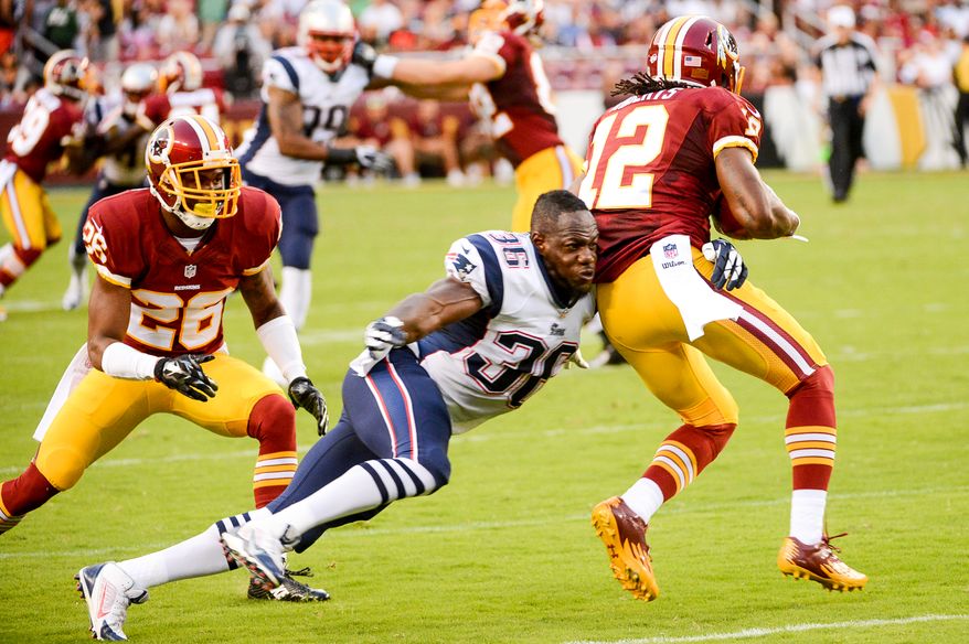 Washington Redskins wide receiver Andre Roberts (12) is tackled by New England Patriots defensive back Kanorris Davis (36) on a punt return as the Washington Redskins play the New England Patriots in NFL preseason football at FedExField, Landover, Md.,  Thursday, August 7, 2014. (Andrew Harnik/The Washington Times)Monday, September 9, 2013. (Andrew Harnik/The Washington Times)