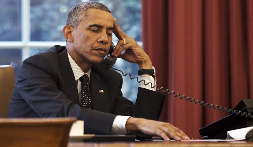 President Barack Obama listens during a phone call with Jordan&#39;s King Abdullah II Jordan, according to the White House, Friday, Aug. 8, 2014, in the Oval Office of the White House in Washington. (AP Photo/Jacquelyn Martin) **FILE**