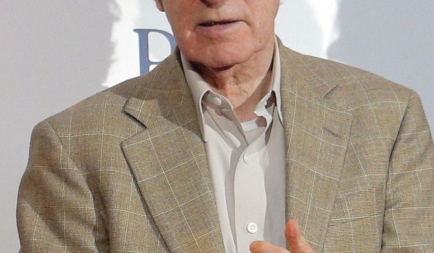 FILE - In this Aug. 27, 2013, file photo, director and actor Woody Allen appears at the French premiere of "Blue Jasmine," in Paris. Allen has added his handprints to the Hollywood Walk of Fame, located in Pawtucket, R.I., but not the one in California. Allen was in town on Thursday, Aug. 7, 2014, filming a new movie, and he agreed to add his handprints to the small “walk of fame” in the old mill town. Allen put his prints into wet cement Thursday afternoon, and it will be installed at a later date. (AP Photo/Christophe Ena, File)