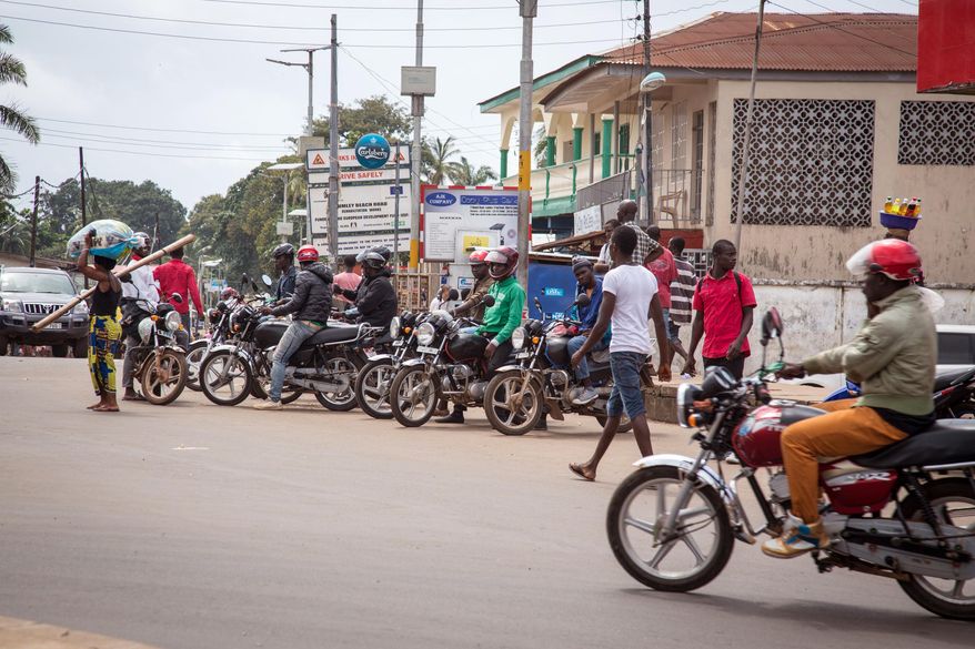 Motorcycle taxis called Okadas, used by the Sierra Leone people as affordable transport have been ordered of the roads from 7am to 7pm, local time to reduce the movement of the local population, by the Government in the city of Freetown, Sierra Leone, Thursday, Aug. 7, 2014. While the Ebola virus outbreak has now reached four countries, Liberia and Sierra Leone account for more than 60 percent of the deaths, according to the World Health Organization, and the outbreak that emerged in March has claimed at least 932 lives. (AP Photo/ Michael Duff)