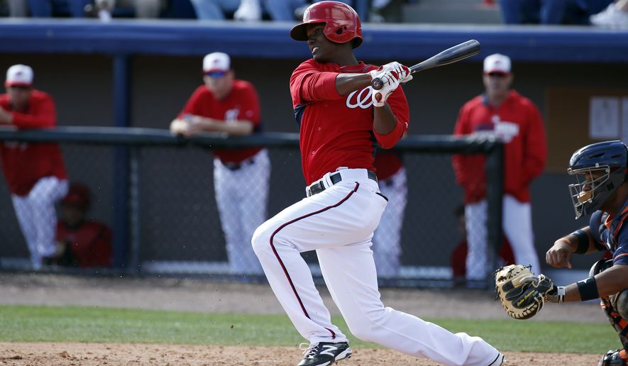 Washington Nationals center fielder Michael Taylor (68) bats in a spring exhibition baseball game against the Houston Astros, Friday, March 7, 2014, in Viera, Fla. The Nationals won 8-5. (AP Photo/Alex Brandon)