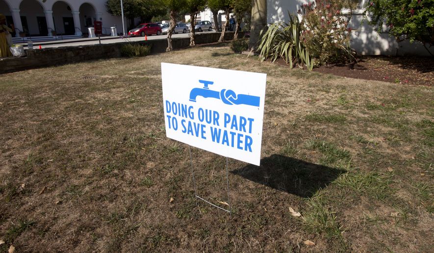 A water conservation sign is shown displayed outside of City Hall in Santa Cruz, Calif., Tuesday, July 29, 2014. (AP Photo/Bay Area News Group, Patrick Tehan) ** FILE **