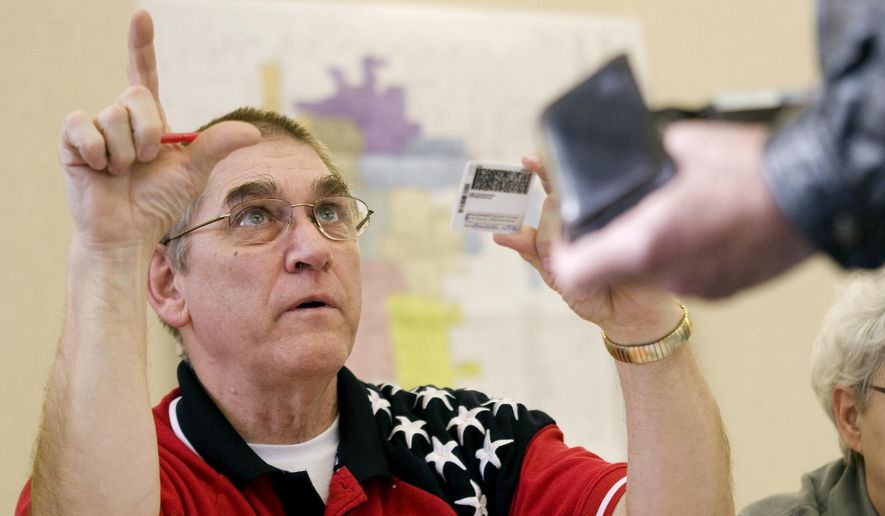 Poll watchers serve as a line of defense against potential voter fraud or election rule-breaking, bringing up concerns to election officials or the political parties themselves so issues can be addressed. (Associated Press/File)