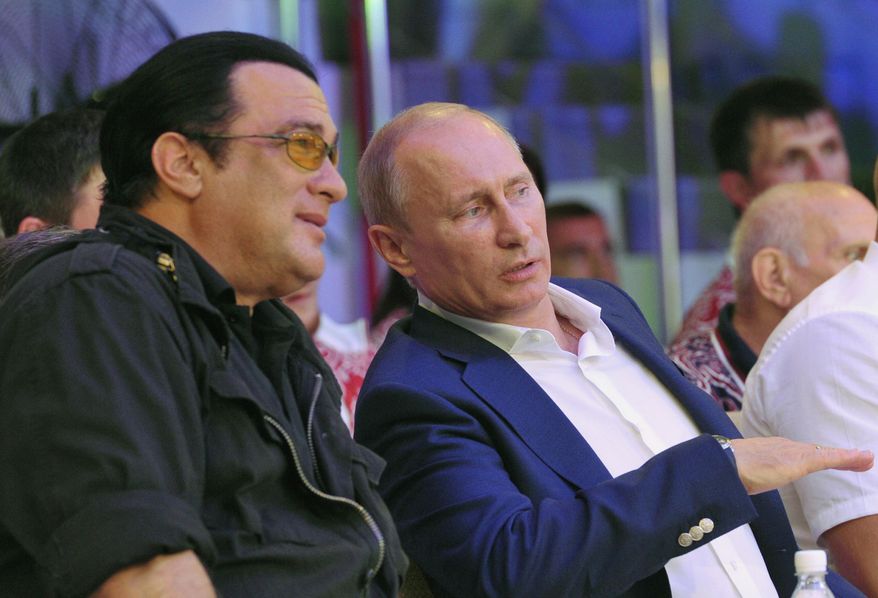 This is a Saturday, Aug. 11, 2012, file photo  Russian President Vladimir Putin, and U.S. actor Steven Seagal, left, as they watch the first Russian national championship of mixed martial arts in the Black Sea resort of Sochi, southern Russia. (AP Photo/RIA-Novosti,  Alexei Nikolsky, Presidential Press Service, File)