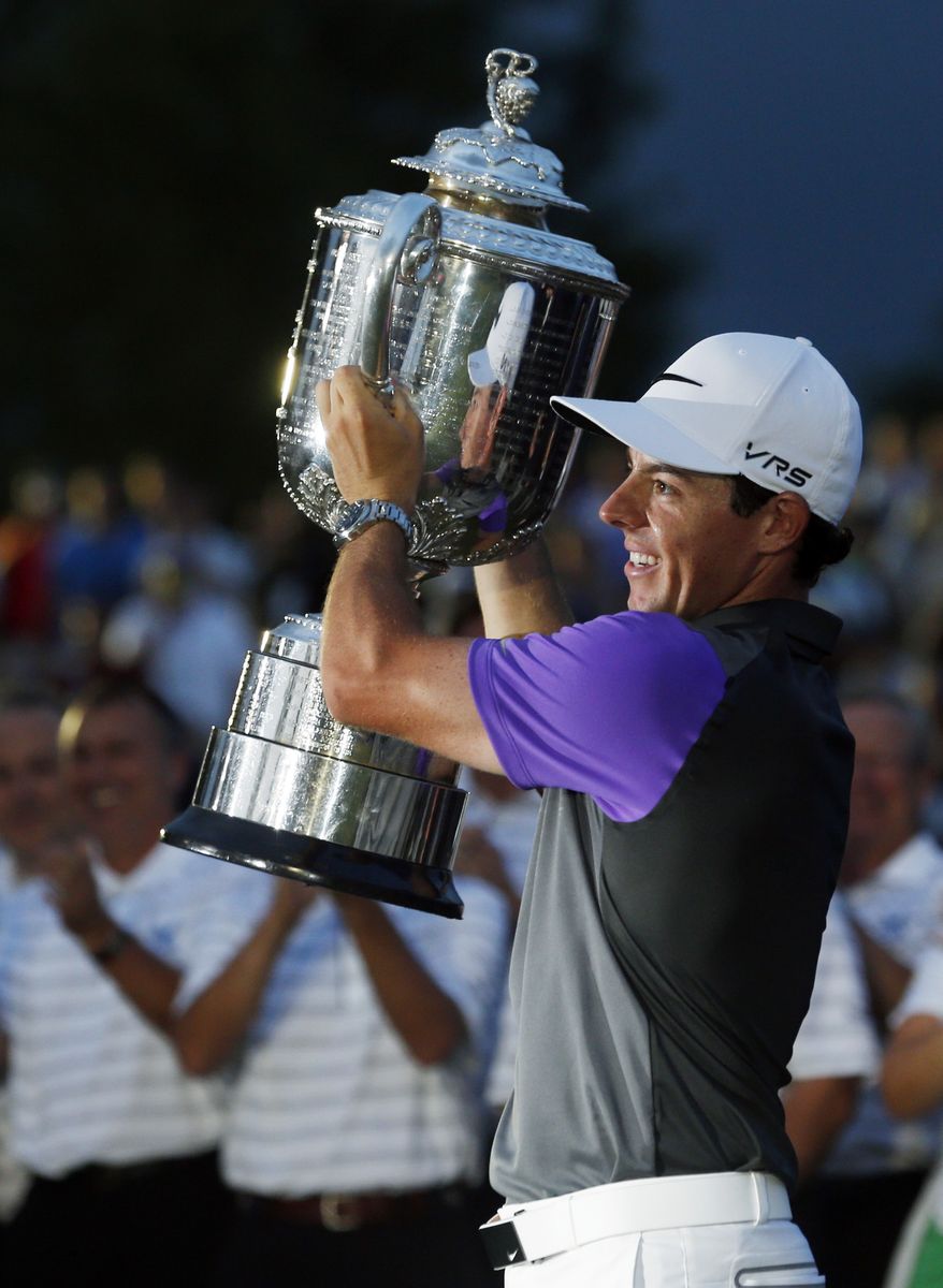 Rory McIlroy, of Northern Ireland, holds up the Wanamaker Trophy after winning the PGA Championship golf tournament at Valhalla Golf Club on Sunday, Aug. 10, 2014, in Louisville, Ky. (AP Photo/Mike Groll)