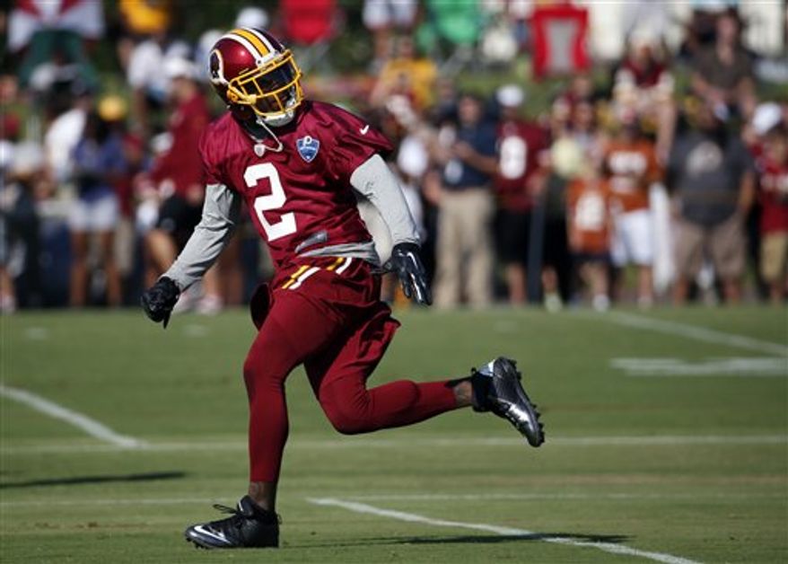 Washington Redskins cornerback DeAngelo Hall runs a drill during practice at the team&#39;s NFL football training facility, Friday, July 25, 2014 in Richmond, Va. (AP Photo)
