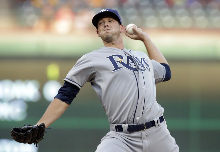 Tampa Bay Rays starting pitcher Drew Smyly works against the Texas Rangers in the first inning of a baseball game, Monday, Aug. 11, 2014, in Arlington, Texas. (AP Photo/Tony Gutierrez)