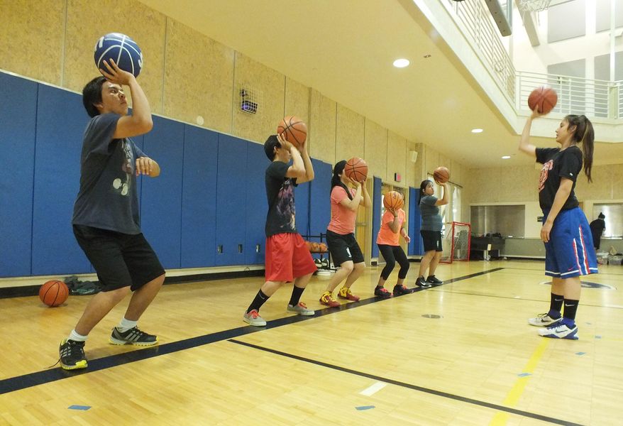 In this photo made Aug. 4, 2014, part of a dozen middle and high school students take part in a basketball camp at the Student Rec Center to learn the Tlingit language at the University of Alaska Southeast in Juneau, Alaska. The Sealaska Heritage Institute sponsors the summer camps each year to help youngsters learn Tlingit. Linguists say there are fewer than 150 native Tlingit speakers alive today. (AP Photo/KTOO, Casey Kelly)