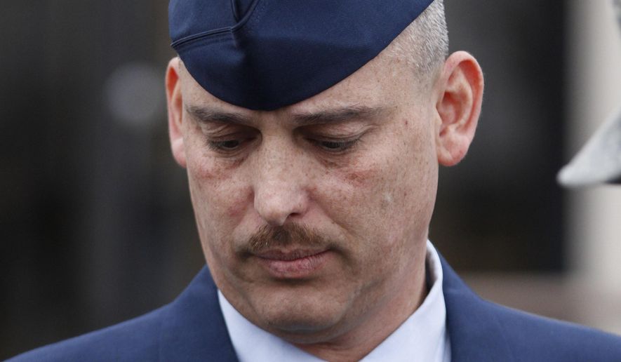 File-In this Wednesday, Jan. 19, 2011, file photo, Air Force Sgt. David Gutierrez walks out of the Law Center at McConnell Air Force Base in Wichita, Kan., during a lunch recess. The highest U.S. armed forces court has agreed to review the appeal of the Kansas airman convicted of assault for exposing multiple sex partners to HIV at swinger parties in Wichita. (AP Photo/Jeff Tuttle, File)