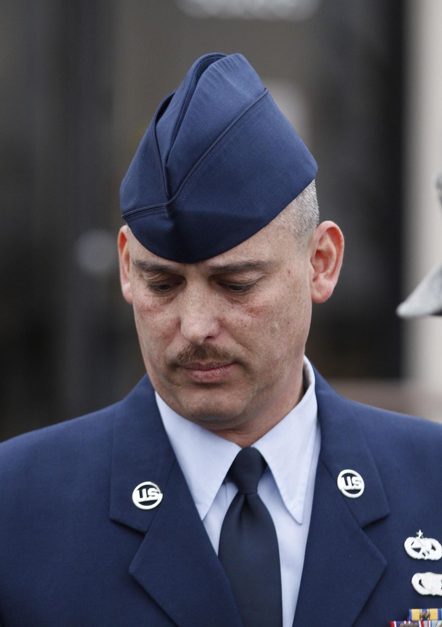 File-In this Wednesday, Jan. 19, 2011, file photo, Air Force Sgt. David Gutierrez walks out of the Law Center at McConnell Air Force Base in Wichita, Kan., during a lunch recess. The highest U.S. armed forces court has agreed to review the appeal of the Kansas airman convicted of assault for exposing multiple sex partners to HIV at swinger parties in Wichita. (AP Photo/Jeff Tuttle, File)