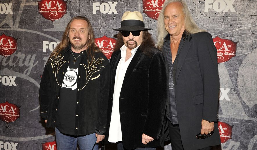 FILE - This Dec. 10, 2012 file photo shows, from left, Johnny Van Zandt, Gary Rossington and Rickey Medlocke of Lynyrd Skynyrd at the American Country Awards in Las Vegas. An all-star cast of performers will salute the seminal Southern rock back during the taping of "One More For The Fans! Celebrating the Songs & Music of Lynyrd Skynyrd. The Nov. 12 concert will feature performances from Gregg Allman, Alabama, Charlie Daniels, Peter Frampton, John Hiatt, Jamey Johnson, Cheap Trick, among others.(Photo by Jeff Bottari/Invision/AP, File)