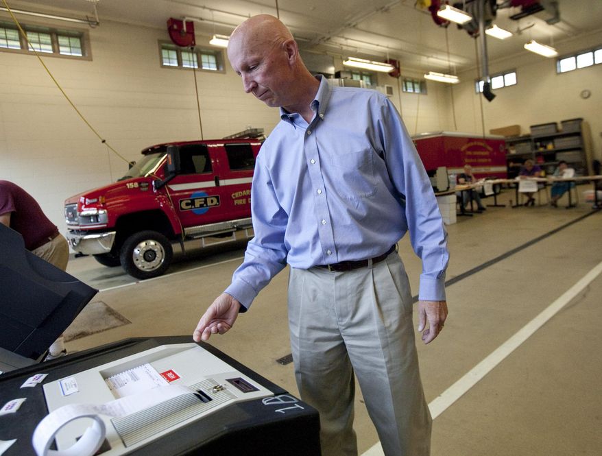 State Rep. Duey Stroebel casts his primary ballot Tuesday, Aug, 12, 2014, at the fire department in Cedarburg, Wis. Stroebel is running for the Republican nomination for the 6th Congressional District. (AP Photo/Milwaukee Journal Sentinel, Kristyna Wentz-Graff)