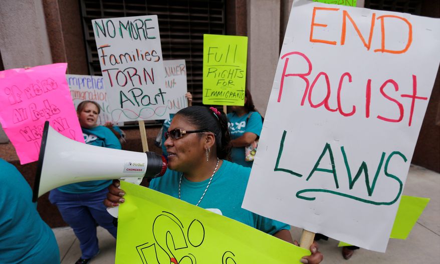 Supporters of immigration reform protest in San Antonio. Gay immigrants are now mounting a campaign to demand that they be included in any unilateral moves President Obama makes this year to halt deportations. (Associated Press)