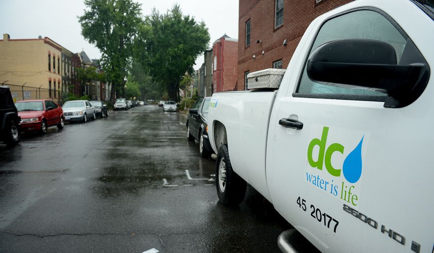 A D.C. Water and Sewer Authority truck sits parked in the flood prone Bloomingdale neighborhood to monitor streets as heavy rain moves through the region causing flooding in some areas, Washington, D.C., Tuesday, Aug. 12, 2014. (Andrew Harnik/The Washington Times) ** FILE **
