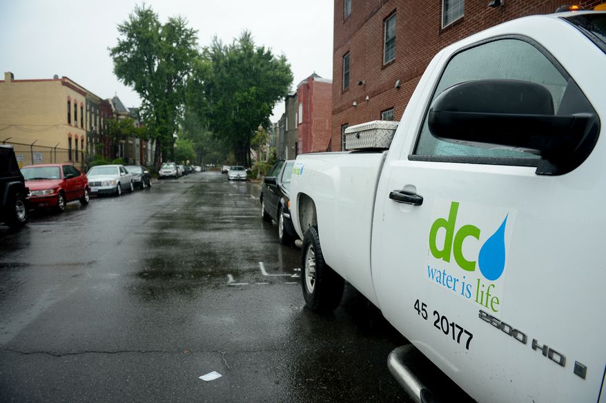 A D.C. Water and Sewer Authority truck sits parked in the flood prone Bloomingdale neighborhood to monitor streets as heavy rain moves through the region causing flooding in some areas, Washington, D.C., Tuesday, Aug. 12, 2014. (Andrew Harnik/The Washington Times) ** FILE **