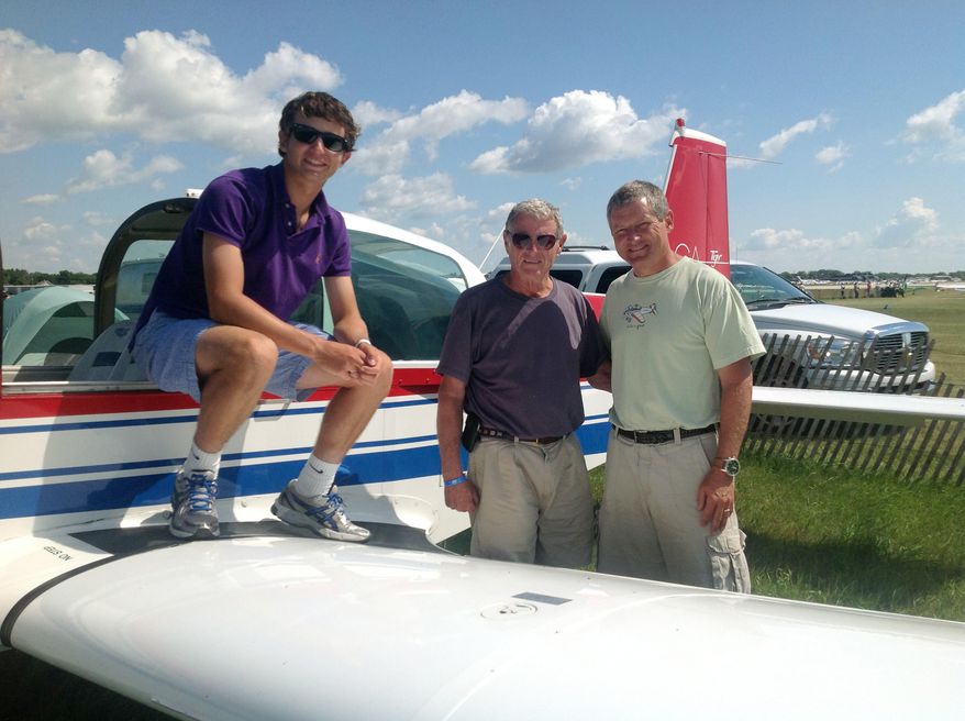 FILE - This Aug. 1, 2013 file photo, courtesy of Sen. James Inhofe, R-Okla., shows, from left, Inhofe's grandson, Cole Inhofe, Sen. Inhofe, and Inhofe's son Perry Inhofe, in Oshkosh, Wis. Perry Inhofe was flying a new type of aircraft for the first time alone when he was killed last November in a plane crash, according to a factual report released this week by the National Transportation Safety Board. (AP Photo/Courtesy of Sen. James Inhofe, Ryan Jackson, File)