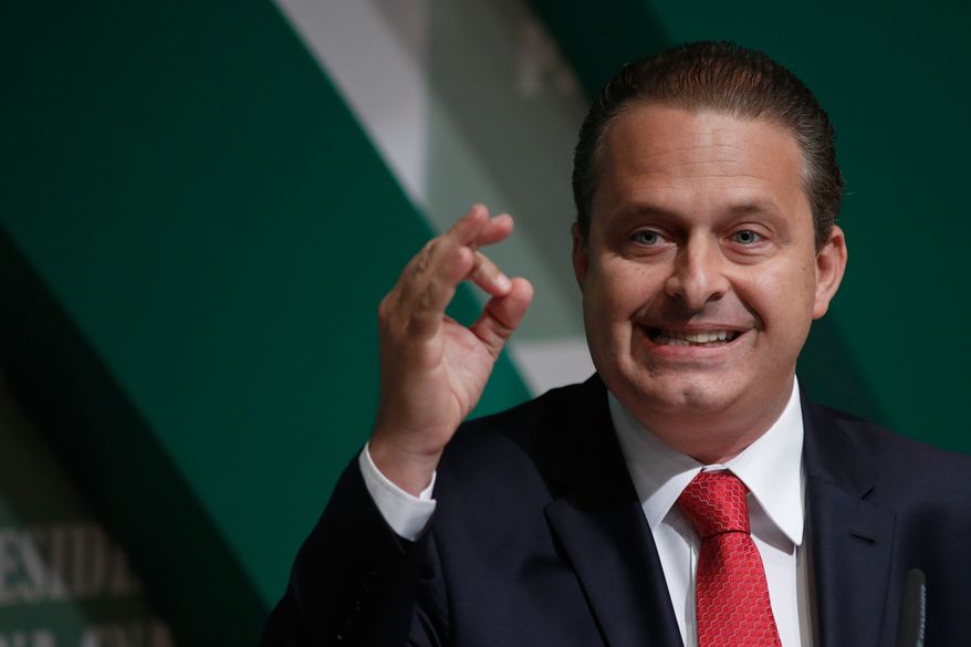 FILE - In this Aug. 6, 2014 file photo, former governor of Pernambuco state and Brazilian Socialist Party (PSB) presidential candidate Eduardo Campos campaigns in Brasilia, Brazil. Local officials say Campos died in an air crash in the city of Santos. He was aboard a small private jet that crashed Wednesday, Aug. 13, 2014, into a residential area in the southeastern port city of Santos, according to city hall officials. (AP Photo/Eraldo Peres, File)