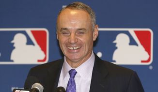 FILE - In this Nov. 14, 2013, file photo, Major League Baseball Chief Operating Officer Rob Manfred talks to the media following baseball&#39;s general managers&#39; meetings in Orlando, Fla. Baseball&#39;s 30 owners will meet in Baltimore this week to vote on Major League Baseball Commissioner Bud Selig&#39;s replacement. A seven-man committee whittled down an expansive list to three candidates: MLB Chief Operating Officer Rob Manfred, Boston Red Sox Chairman Tom Werner and MLB Executive Vice President of Business Tim Brosnan. (AP Photo/Reinhold Matay, File)
