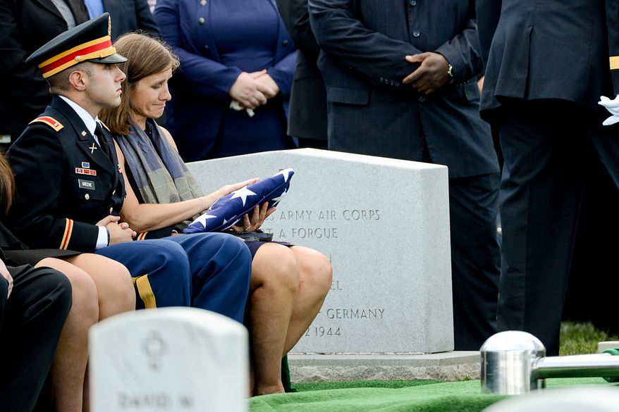 The family of Army Maj. Gen. Harold J. Greene, son Army 1st Lt. Matthew Greene, left, and his wife, Dr. Susan Myers, right, during his funeral service at Section 60 at Arlington National Cemetery, Arlington, Va., Thursday, August 14, 2014. Greene was killed in Afghanistan while at the national military academy in Kabul. He was the highest-ranking U.S. Army officer killed in combat since the Vietnam War. (Andrew Harnik/The Washington Times)