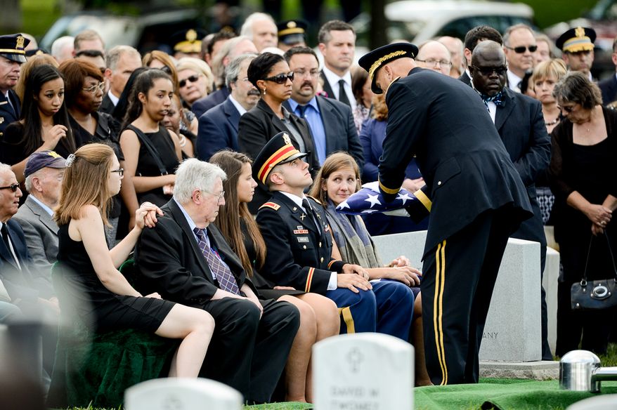 The family of Army Maj. Gen. Harold J. Greene, from left, daughter-in-law Kasandra Greene, father Harold Greene, daughter Amelia Greene, son Army 1st Lt. Matthew Greene and his wife, Dr. Susan Myers, during his funeral service at Section 60 at Arlington National Cemetery, Arlington, Va., Thursday, August 14, 2014. Greene was killed in Afghanistan while at the national military academy in Kabul. He was the highest-ranking U.S. Army officer killed in combat since the Vietnam War. (Andrew Harnik/The Washington Times)