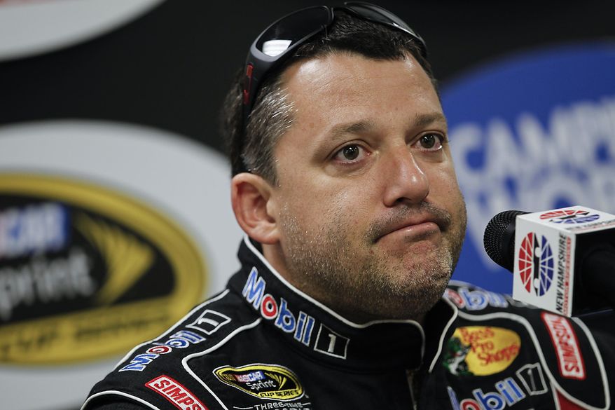 FILE - In this July 12, 2013 file photo, NASCAR driver Tony Stewart speaks at a press conference prior to NASCAR practice at the New Hampshire Motor Speedway in Loudon, N.H. Stewart is skipping a third straight Sprint Cup race, and it is not clear when the NASCAR star might return after he struck and killed a driver at a dirt-track race in New York. (AP Photo/Cheryl Senter, File)