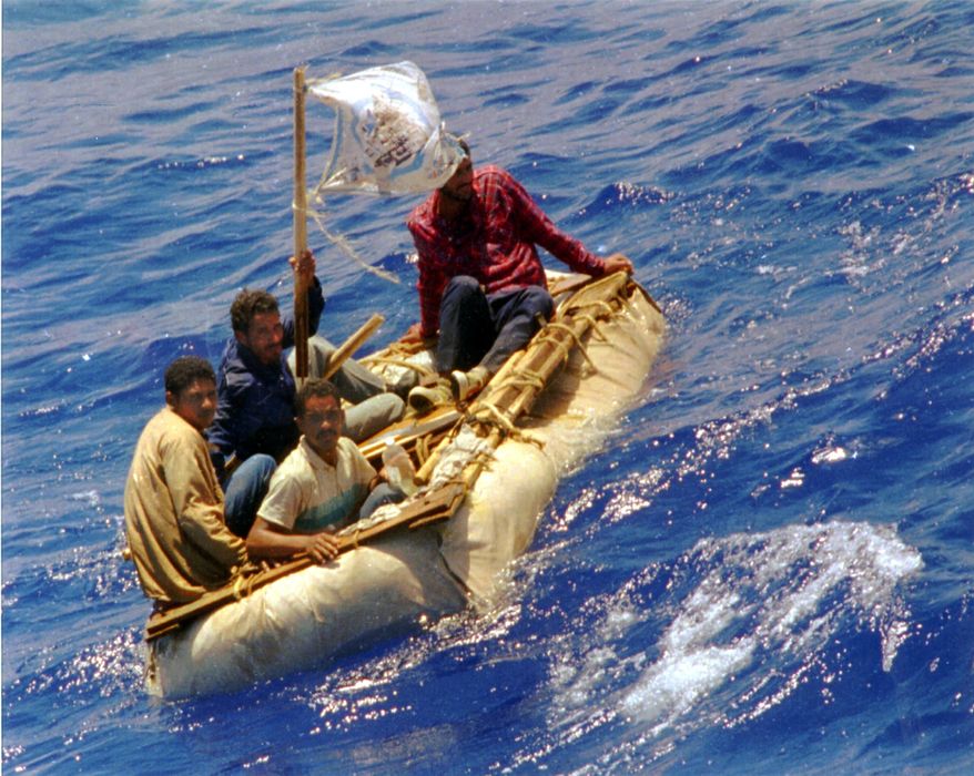 FILE --In this Aug. 26, 1994 file photo, Cuban refugees float in heavy seas 60 miles south of Key West, Fla. In the 20 years since Fidel Castro set off a high-seas humanitarian crisis by encouraging an exodus of 35,000 islanders, more than 26,000 other Cubans have risked their lives crossing the Florida Straits. Already this year, nearly 3,000 have been picked up by U.S. authorities, on a pace to double last year’s total. Experts say it shows the limits of the “wet-foot, dry-foot” policy that solved the 1994 crisis. (AP Photo/Dave Martin, File)